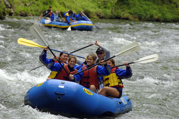 high fives among whitewater rafters