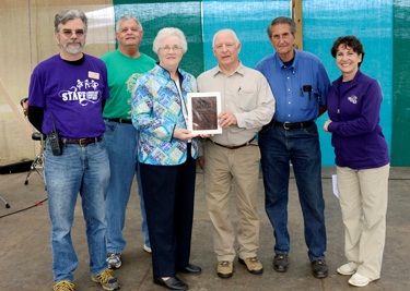 Officers from the Jackson County Genealogical Society accept a 2012 Mountain Heritage Award from Scott Philyaw (far left), director of WCU’s Mountain Heritage Center, and Susan Belcher (far right), wife of WCU Chancellor David O. Belcher. Representing the society are (from left) Kenny Nicholson, president; Ruth Shuler, office manager; and Bud Cantrell and Bill Crawford, vice presidents. 