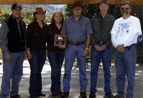 Members of Jackson County's Deitz Family band receive the 2006 Mountain Heritage Award at Western Carolina University's 32nd annual Mountain Heritage Day held Saturday (Sept. 30). Family members were presented the award by WCU Provost Kyle Carter (far left) and Mountain Heritage Center Director Scott Philyaw (far right.) Family members are (left to right) Chrystal, Delores, Bill and Joe Deitz.