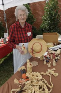 Annie Lee Bryson with a sampling of her cornshuck crafts at Mountain Heritage Day.