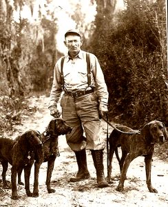 Von Plott and his dogs. Courtesy of the State Archives of North Carolina.